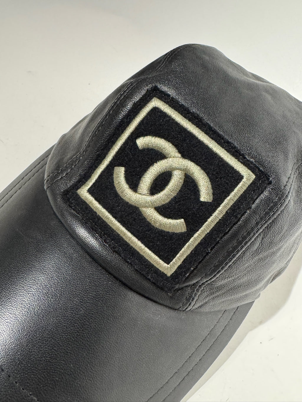 Chanel Black with Gold Yellow Logo Lambskin Hat