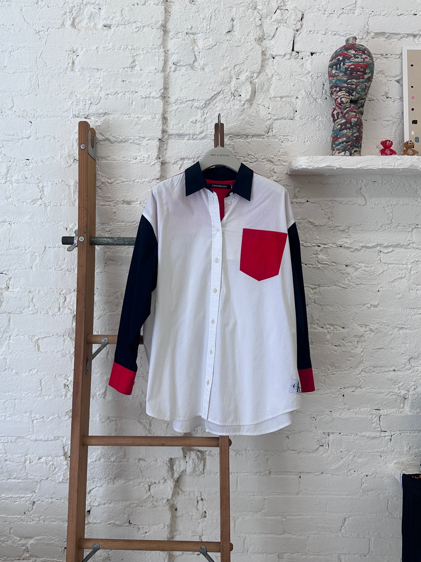 WAS-25824 Calvin Klein Black and white shirt with red pocket